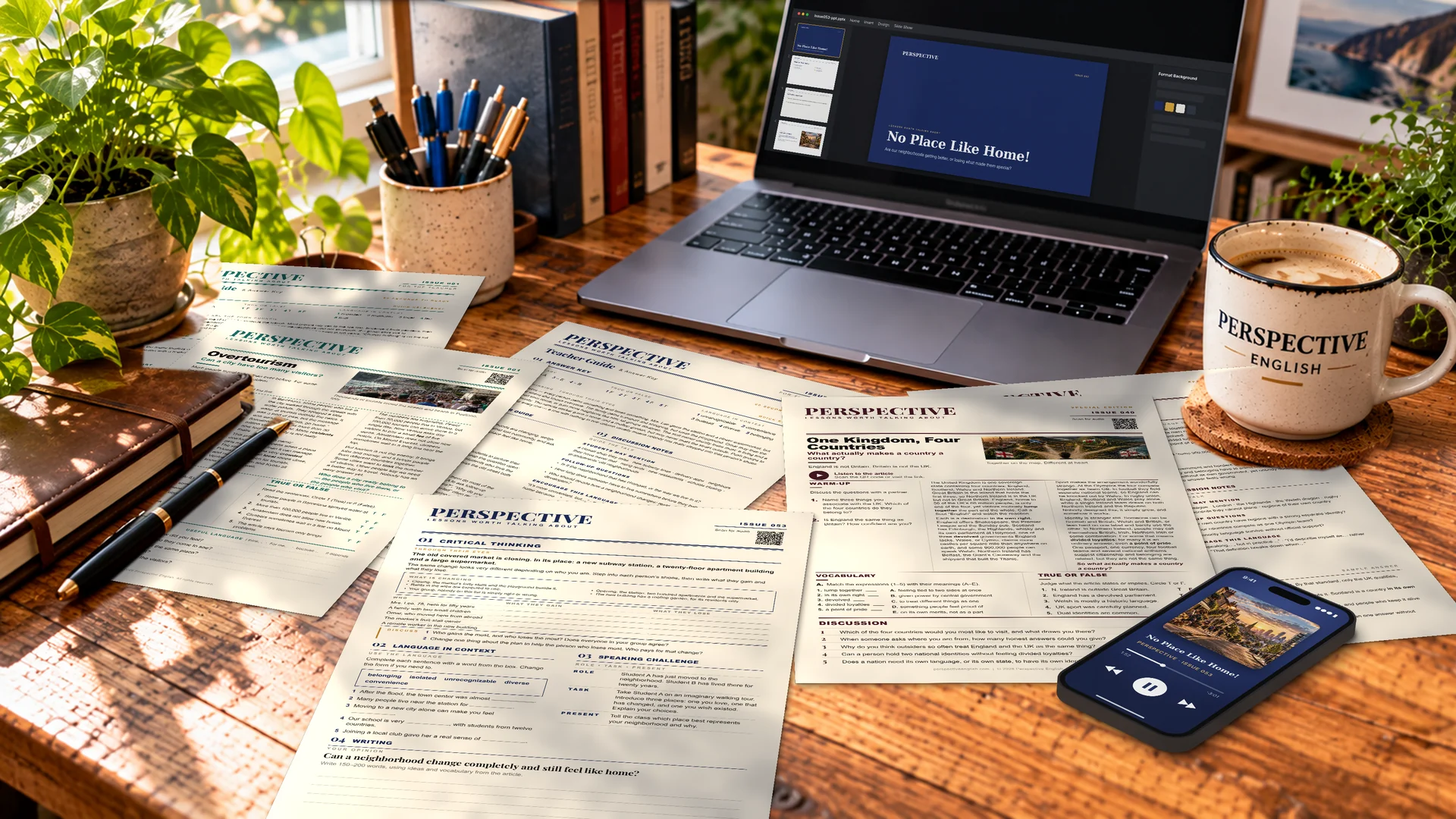 Perspective English student worksheets, teacher guides, PowerPoint presentation and lesson audio arranged on a teacher’s desk